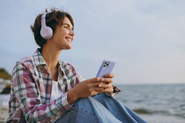 Girl listeninto music through headphones
